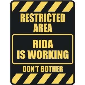   RESTRICTED AREA RIDA IS WORKING  PARKING SIGN: Home 