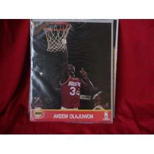    AKEEM OLAJUWON 8X10 PLAYER CARD WITH STATS ON BACK 