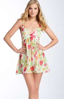 Gorgeous blooms tumble across a sheer chiffon babydoll chemise 