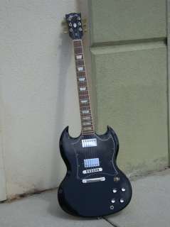 Thisa is a cool Black finished Standard, Trapizoid inlaid Bound neck 