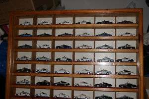rare and awesome display of 60 police cars in casing  