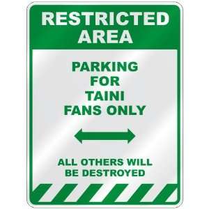   PARKING FOR TAINI FANS ONLY  PARKING SIGN