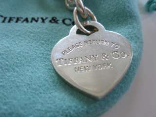   tag charm is marked 925 and PLEASE RETURN TO TIFFANY & CO. NEW YORK
