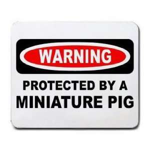    WARNING PROTECTED BY A MINIATURE PIG Mousepad: Office Products