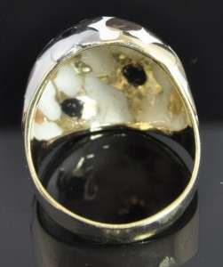   gold. Microscopic chip in black enamel at center of one accent flower