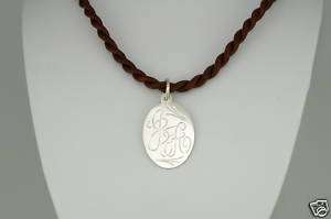 STERLING SILVER MONOGRAM W/BROWN SILK CORD NECKLACE.  