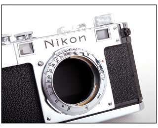   Mint  Nikon S rangefinder film camera in silver w/leather case  