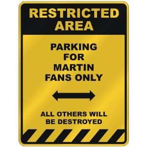  RESTRICTED AREA  PARKING FOR MARTIN FANS ONLY  PARKING 